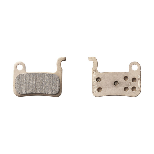 Shimano Pastilla metálica M06-MX y muelle con pasador de aletas (par)
